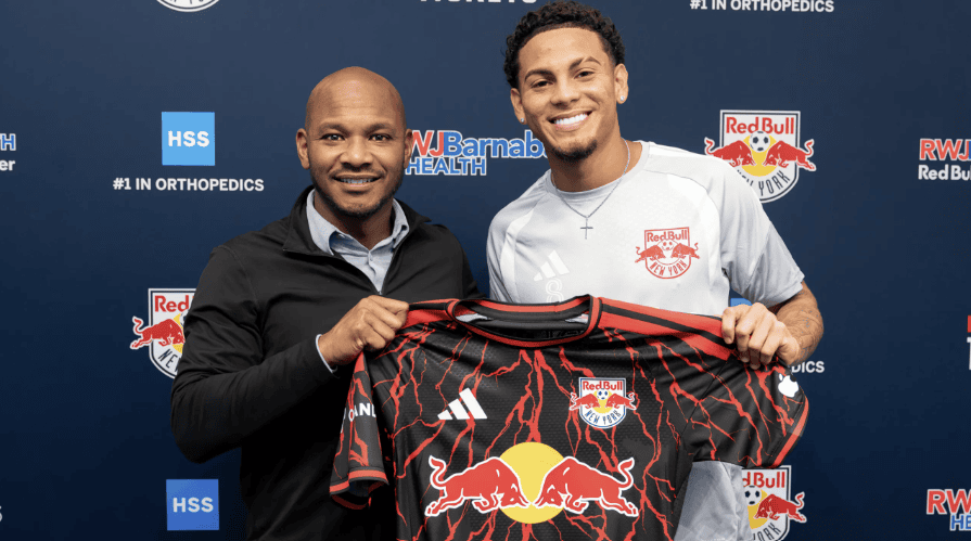 Red Bull New York midfielder David Ruiz poses with the club's head of sport Julian de Guzman.