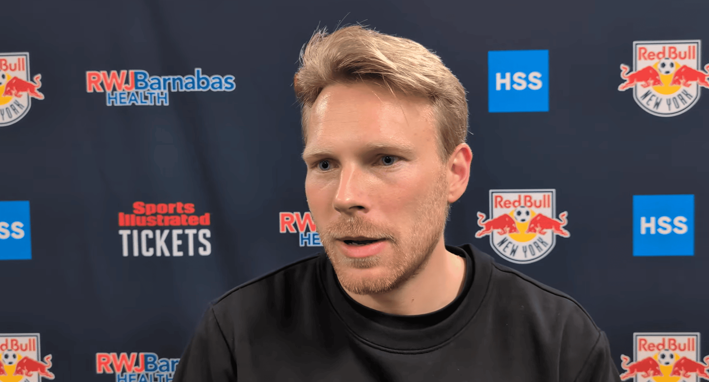Red Bull New York II head coach Dominik Wohlert speaks to reporters.