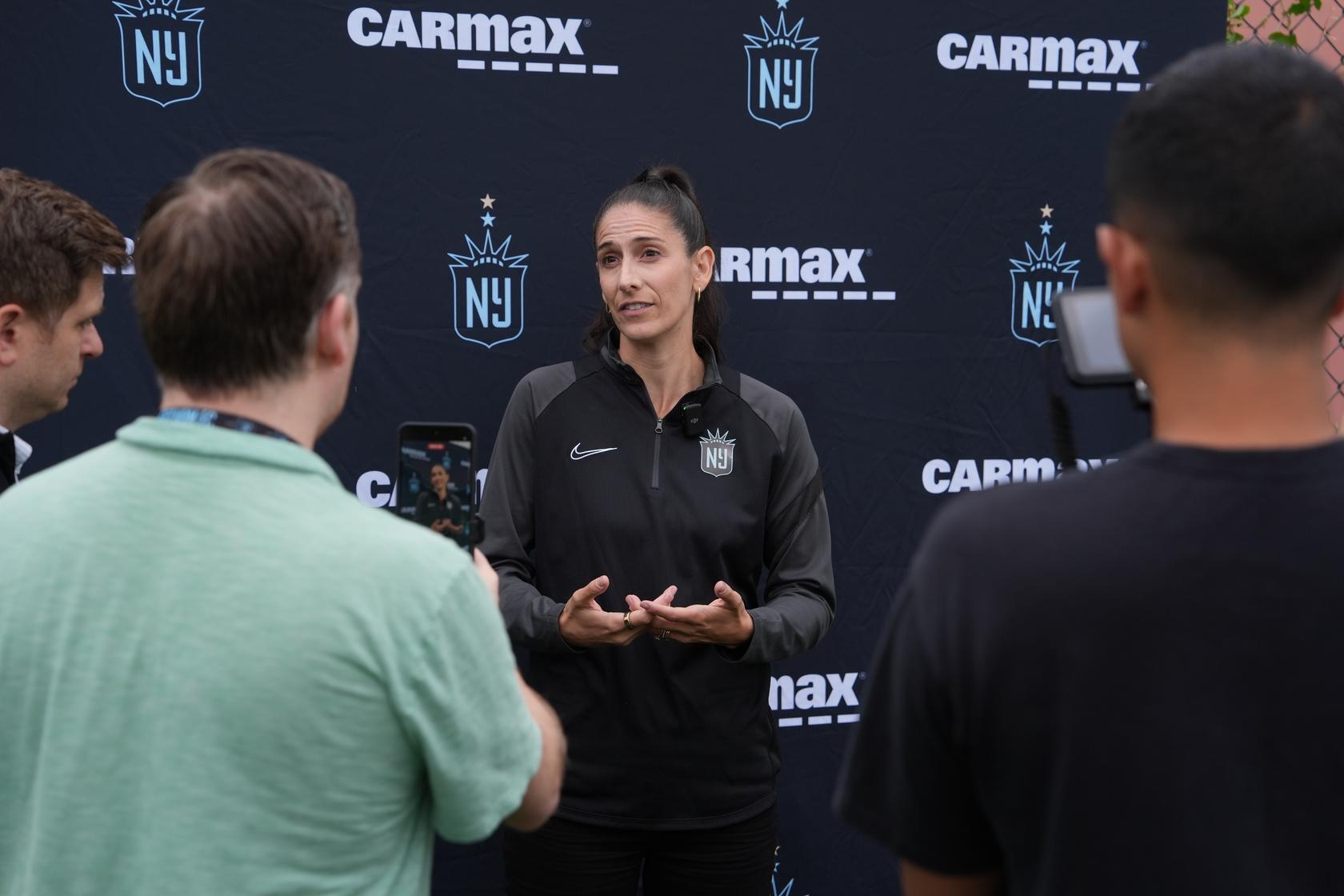 Gotham FC president of soccer operations Yael Averbuch West speaks to the press at training.