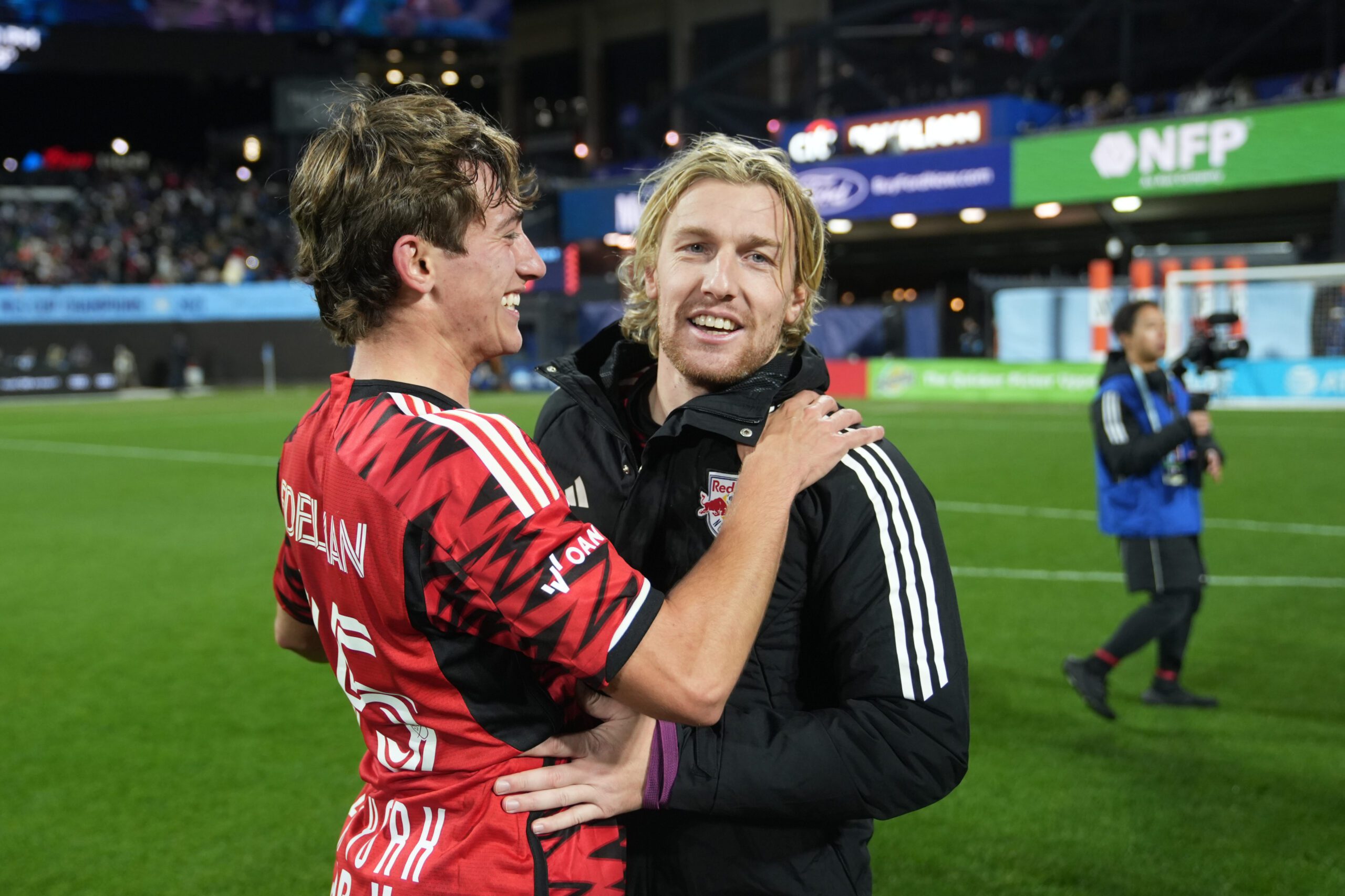 Red Bull New York midfielder Daniel Edelman celebrates with captain Emil Forsberg.