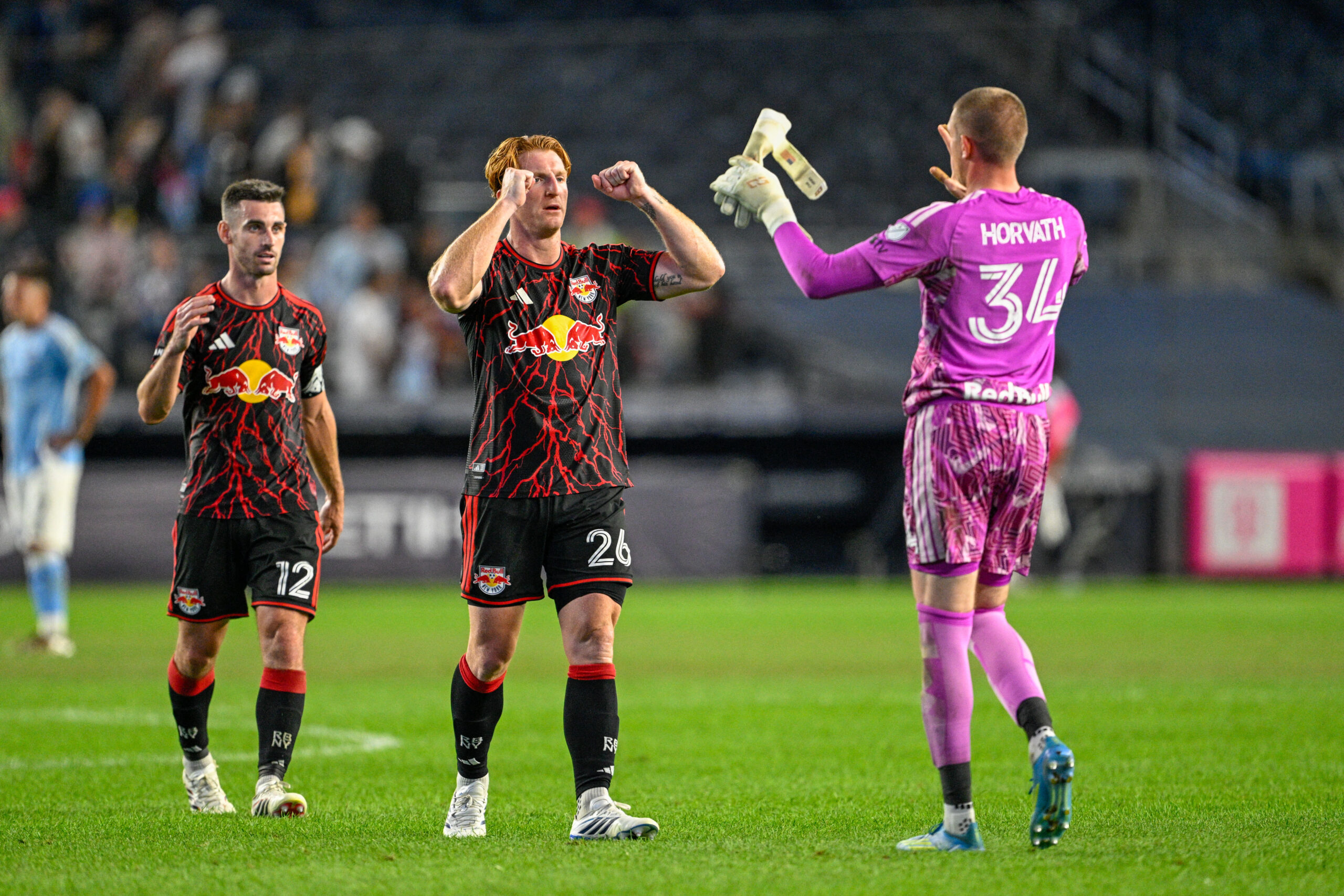 Red Bull New York goalkeeper Ethan Horvath celebrates a win with teammates.