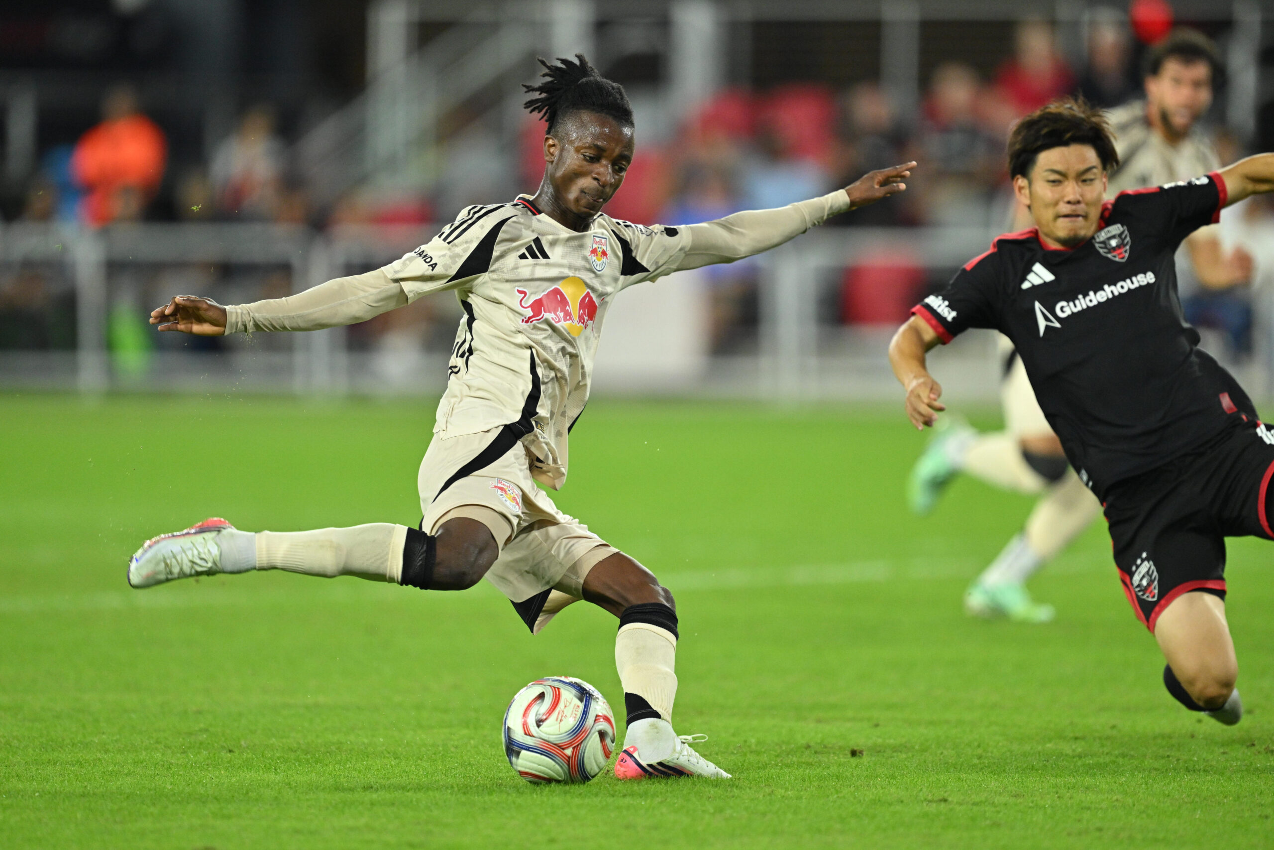 Red Bull New York midfielder Mohammed Sofo attempts a shot on goal.