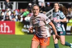 Gotham FC forward Olivia Wingate and Washington Spirit defender Gabrielle Carle chase after the ball during the second half at Audi Field.