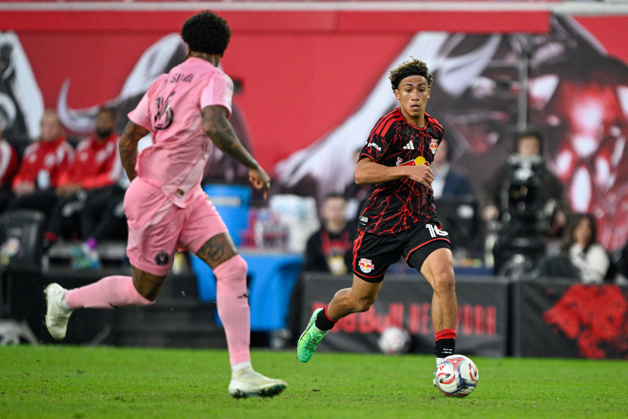 Red Bull New York forward Julian Hall runs with the ball against Inter Miami during the first half at Sports Illustrated Stadium.
