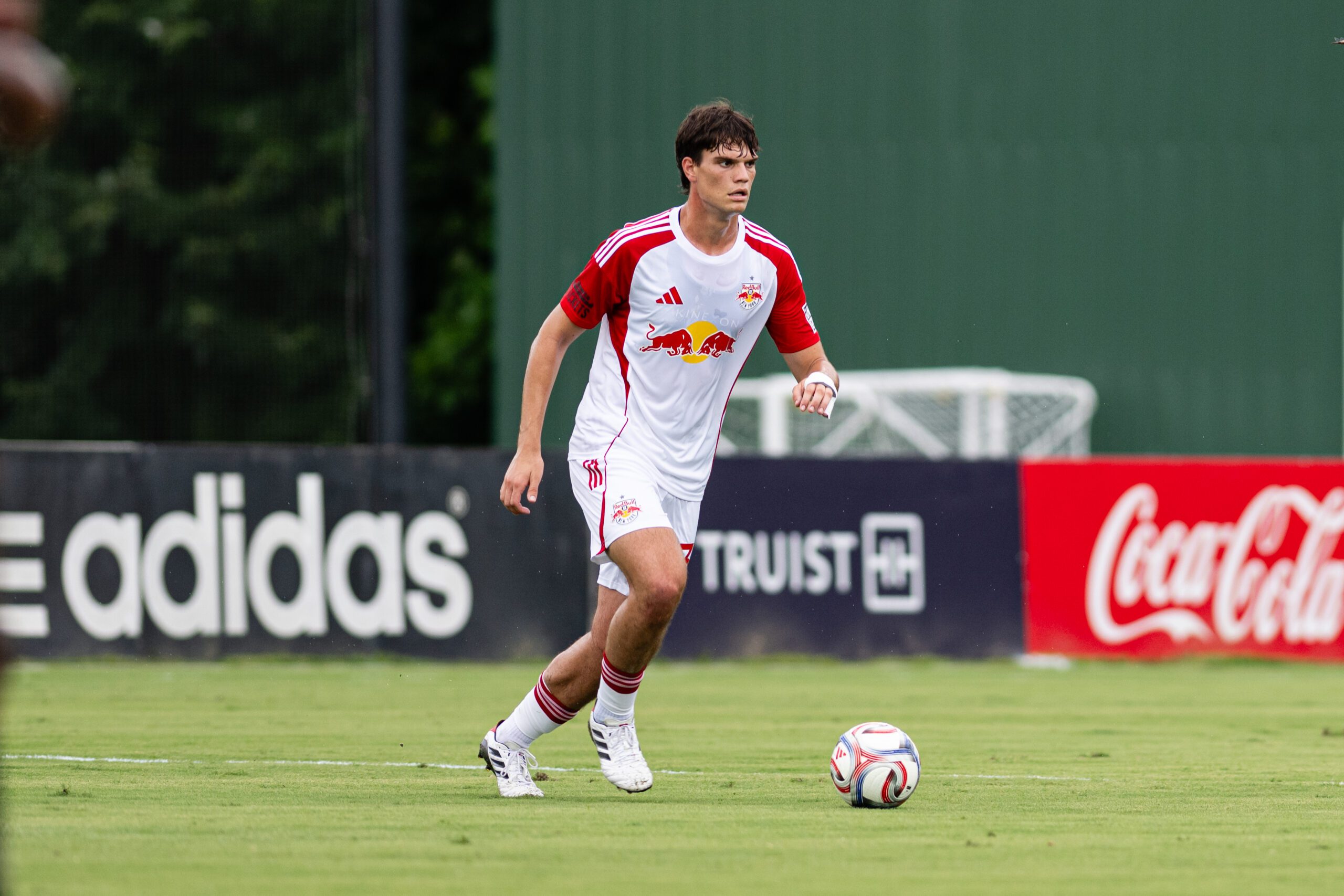 Red Bull New York II defender Jason Bori controls the ball.