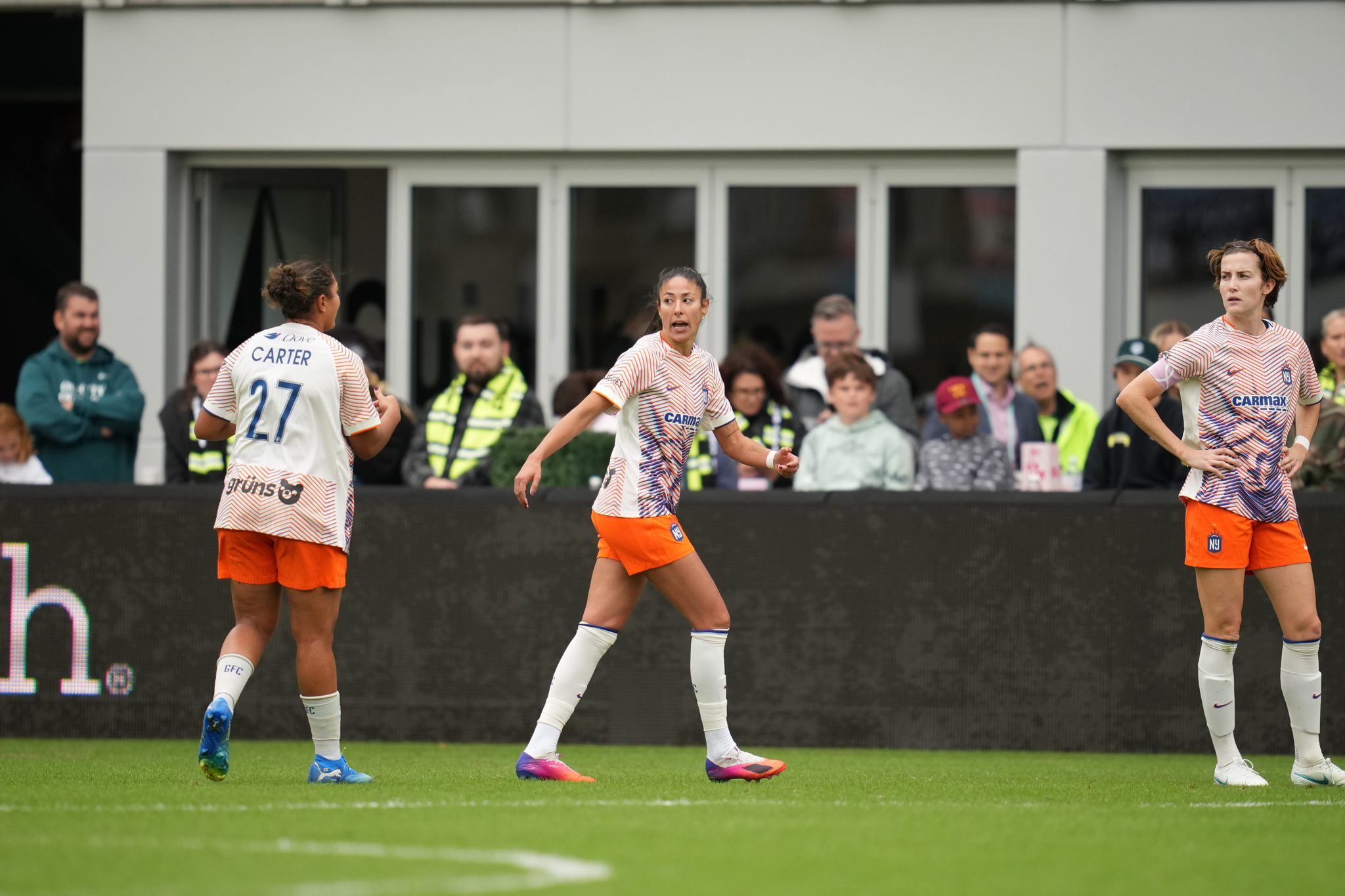 Gotham FC defenders Jess Carter, Leila Ouahabi and Tierna Davidson communicate during a match.