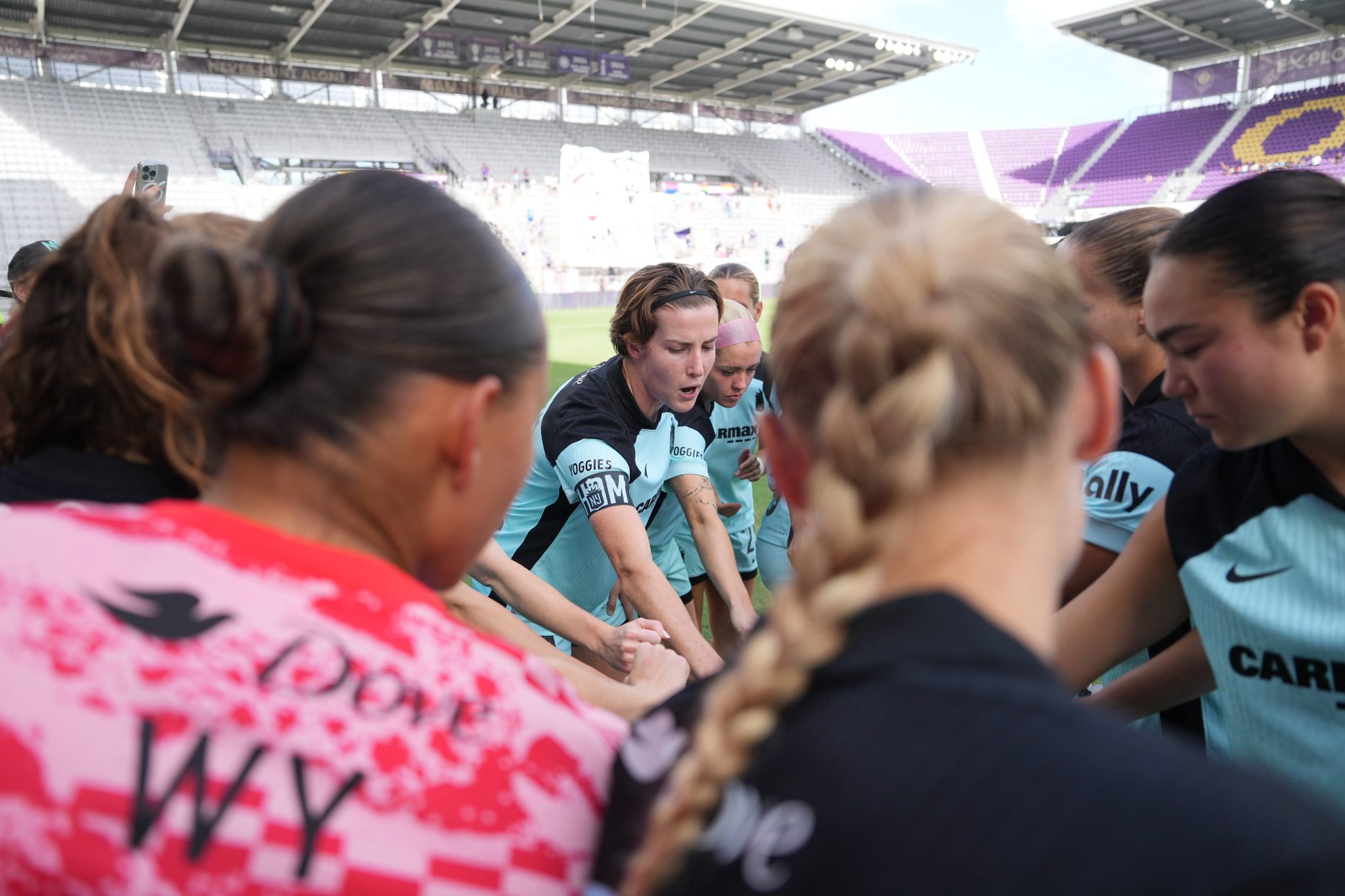 Captain Tierna Davidson leads a Gotham FC huddle.